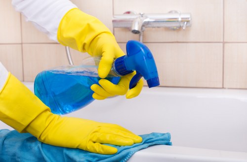 Local cleaner carrying out kitchen cleaning in Southkensington