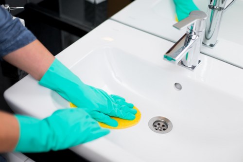 Local cleaner working in a South Kensington apartment kitchen